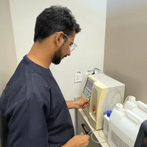 Veterinarian performing bloodwork during a pet wellness exam at Zia Vet Clinic